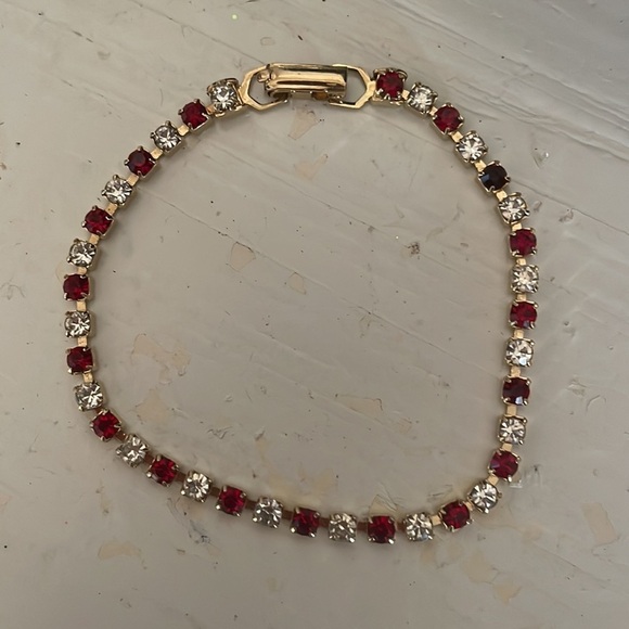 7.5” gold plated tennis bracelet with 38 prong set red and clear crystals - Picture 12 of 15